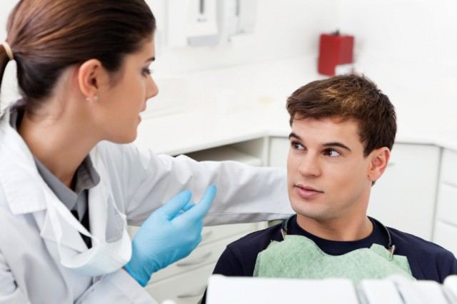 dentist and patient in conversation